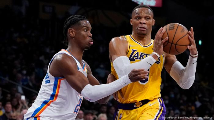 Los Angeles Lakers jersey Russell Westbrook defends the ball from Oklahoma City Thunder's Shai Gilgeous-Alexander