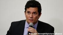 Brazil's Justice Minister Sergio Moro gives a press conference to announce his resignation in Brasilia, Brazil, Friday, April 24, 2020. Moro made the announcement after Brazilian President Jair Bolsonaro changed the head of the country's federal police. (AP Photo/Eraldo Peres)