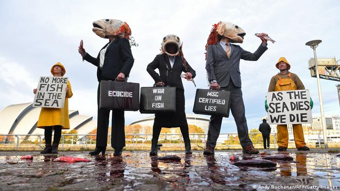 Activists dressed as fish protest for more sustainability