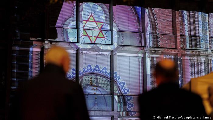 pictures of the synagogue projected on the wall of the Science Ministry building for the state of Lower Saxony