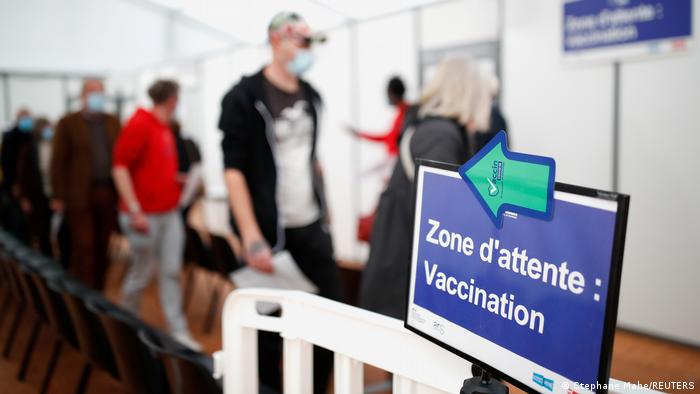 People in line at a vaccination center in France