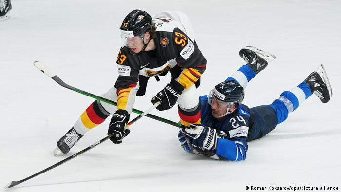 A Finnish defender tries to stop Moritz Seider's progress