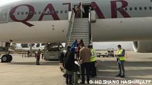 Passengers board a Qatar Air aircraft bound to Doha at Kabul airport on November 4, 2021. (Photo by Hoshang HASHIMI / AFP)