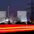 FILE - The blur of car lights passing by the nuclear power plant Biblis, south of Frankfurt, central Germany, in a Jan 23, 2006 file photo. German leaders reached an agreement to grant the country's nuclear power plants an average of 12 extra years of production time and to levy new fees on the utility companies', stripping them of billions of their expected additional profits, a government official said Sunday, Sept. 5, 2010. (AP Photo/Michael Probst)