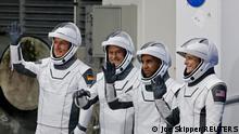 European Space Agency (ESA) astronaut Matthias Maurer of Germany, NASA astronauts Raja Chari, Tom Marshburn, and Kayla Barron wave while departing the crew quarters for launch aboard a SpaceX Falcon 9 rocket on a mission to the International Space Station at the Kennedy Space Center in Cape Canaveral, Florida, U.S., November 10, 2021. REUTERS/Joe Skipper