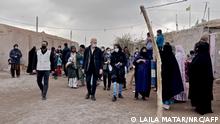 This handout picture obtained from the Norwegian Refugee Council (NRC) on November 10, 2021, shows NRC's director-general Jan Egeland (C) visiting Afghan refugees in Bardsir settlement in Iran's southern province of Kerman. - Bardsir settlement for refugees is home to around 1,450 Afghan families, many of whom have been there for over 30 years. It is one of the 20 refugee settlements in the Iran where the number of refugees is growing, with a daily influx of refugees arriving from Afghanistan since the Taliban took over of the country following the US withdrawal in August 2021. (Photo by LAILA MATAR / NORWEGIAN REFUGEE COUNCIL (NRC) / AFP) / RESTRICTED TO EDITORIAL USE - MANDATORY CREDIT AFP PHOTO /NRC - NO MARKETING - NO ADVERTISING CAMPAIGNS - DISTRIBUTED AS A SERVICE TO CLIENTS
