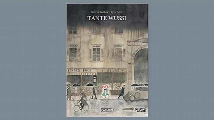 The novel's cover features grey buildings and people walking in the rain.