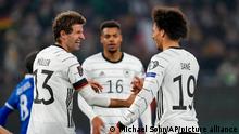 Germany's Leroy Sane, right, is congratulated by teammate Thomas Muller after he scored his team's fifth goal during the World Cup 2022 group J qualifying soccer match between Germany and Liechtenstein in Wolfsburg, Germany, Thursday, Nov. 11, 2021. (AP Photo/Michael Sohn)