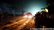 Polish police guard Poland/Belarus border near Kuznica, Poland, in this photograph released by the Police, November 12, 2021. Policja Podlaska/Handout via REUTERS THIS IMAGE HAS BEEN SUPPLIED BY A THIRD PARTY
