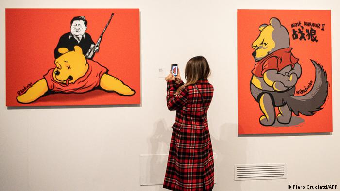  A visitor takes photos of Winnie the Trophies, 2017, an artwork by Chinese dissident artist Badiucao