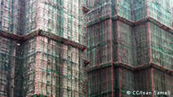 Bamboo scaffolding around skyscrapers in construction – Hong Kong