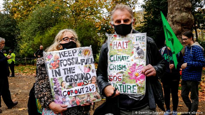 Two protesters at the COP26 UN climate conference in Glasgow, UK.
