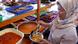 Woman serves Betawi dishes at her stall Woman serves Betawi dishes at her stall