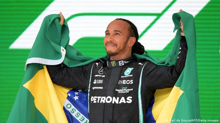 Lewis Hamilton celebrates winning the Brazil Grand Prix
