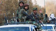 Members of Taliban sit on a military vehicle during Taliban military parade in Kabul, Afghanistan November 14, 2021. REUTERS/Ali Khara NO RESALES. NO ARCHIVES