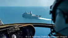 October 24, 2021 - Red Sea - Capt. Daniel Fallon, assigned to Marine Medium Tiltrotor Squadron VMM 165 Reinforced, 11th Marine Expeditionary Unit MEU, observes the amphibious transport dock USS Portland LPD 27 transiting the Red Sea, Oct. 25. Portland and the 11th MEU are deployed to the U.S. 5th Fleet area of operations in support of naval operations to ensure maritime stability and security in the Central Region, connecting the Mediterranean and Pacific through the Western Indian Ocean and three strategic choke points. Sgt. Alexis Flores Red Sea - ZUMAz03_ 20211024_skx_z03_711 Copyright: xU.S.xMarinesx 