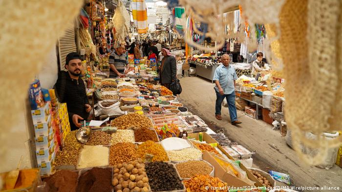 A local market in Iraq with dried fruits on display