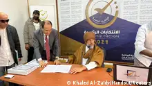 Saif al-Islam al-Gaddafi, son of Libya's former leader Muammar al-Gaddafi, registers as a presidential candidate for the December 24 election, at the registration centre in the southern town of Sebha, Libya November 14, 2021. Khaled Al-Zaidy/Handout via REUTERS ATTENTION EDITORS - THIS IMAGE WAS PROVIDED BY A THIRD PARTY. NO RESALES. NO ARCHIVES. REFILE - CORRECTING YEAR