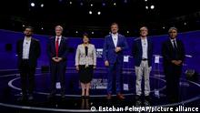 Chilean presidential candidates, from left, Gabriel Boric from the Apruebo Dignidad coalition party, Jose Antonio Kast from the Partido Republicano, Yasna Provoste from the Unidad Constituyente party, Sebastián Sichel of the center-right government coalition, Eduardo Artes of the Partido Comunista-Acción Proletaria y Unión Patriótica, and Marco Henriquez-Ominami from the left-wing Progressive Party, pose for a photo prior to the presidential debate in Santiago, Chile, Monday, Nov. 15, 2021. Chile will hold its presidential election on Nov. 21. (AP Photo/Esteban Felix, Pool)