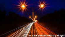 (Langzeitbelichtung) Automobiles move along the highway leaving light trails outside Moscow on November 15, 2021. (Photo by Yuri KADOBNOV / AFP) (Photo by YURI KADOBNOV/AFP via Getty Images)