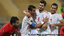 Iran's defender Ehsan Hajsafi (2nd-L) celebrates with teammates after scoring the second goal during the 2022 Qatar World Cup Asian Qualifiers football match between Syria and Iran, at the King Abdullah II stadium in the Jordanian capital Amman, on November 16, 2021. (Photo by Khalil MAZRAAWI / AFP) (Photo by KHALIL MAZRAAWI/AFP via Getty Images)
