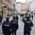 Police officers walk along a shopping street in Vienna after the Austrian government placed roughly two million people who are not fully vaccinated against the coronavirus disease under lockdown