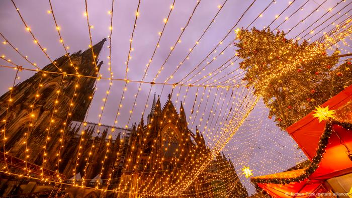 View of Cologne Cathedral through festive lights at the Christmas Market, Germany