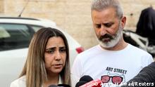 Israeli couple Mordi and Natali Oknin speak to the media following their release after being detained over espionage charges for allegedly taking photographs of President Tayyip Erdogan's residence during a trip to Istanbul, Turkey, at his home in Modiin, Israel November 18, 2021 REUTERS/Ammar Awad