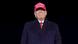 Ex-US President Donald Trump grins widely with a 'Make America Great Again' hat on Ex-US President Donald Trump grins widely with a 'Make America Great Again' hat on