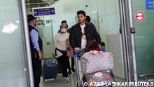 Iraqi migrants, who voluntarily registered for an evacuation flight from Belarus, arrive at Erbil International Airport, in Erbil, Iraq, November 18, 2021. REUTERS/Azad Lashkari
