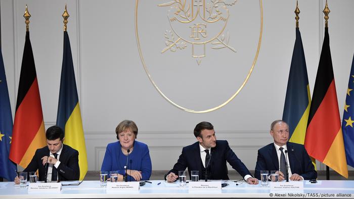 Ukraine's President Volodymyr Zelenskyy, Germany's Chancellor at the time Angela Merkel, France's President Emmanuel Macron, and Russia's President Vladimir Putin at a Normandy Four press conference in Paris in 2019