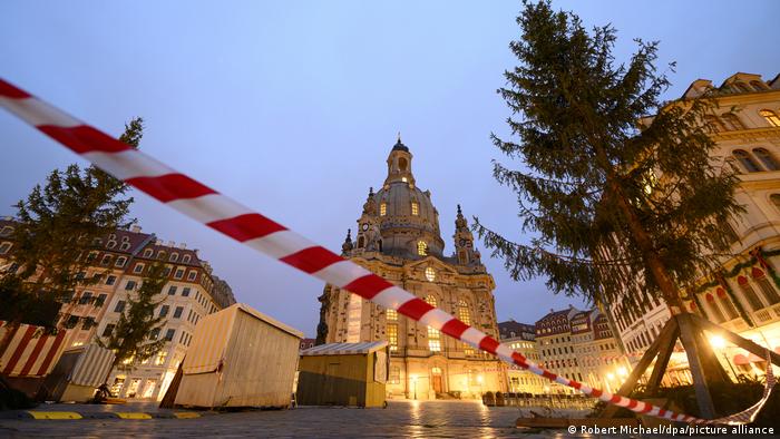 The Christmas market at Dresden's Frauenkirche closed behind tape