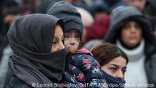 GRODNO REGION, BELARUS - NOVEMBER 19, 2021: Migrants at the Bruzgi transport and logistics centre on the Belarusian-Polish border. The migrant crisis on the border of Belarus with Poland, Lithuania, and Latvia escalated on November 8. Several thousand migrants have approached the Belarusian-Polish border and set up a tent camp there. This year Polish border guards have foiled over 35 thousand attempts to illegally cross the Belarusian-Polish border, which is 400 times more than last year. Leonid Shcheglov/BelTA/TASS
