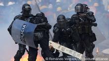 Police detain a man during continuing anti-government protest triggered by proposed tax increases on public services, fuel, wages and pensions in Bogota, Colombia, Monday, June 28, 2021. (AP Photo/Fernando Vergara)