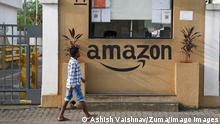 October 1, 2021, Mumbai, Maharashtra, India: A man walks past the security cabin of amazon warehouse..Amazon is an e-commerce company selling different variety of goods online to shoppers on their website. Mumbai India - ZUMAs197 20211001_zab_s197_108 Copyright: xAshishxVaishnavx