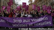 Women demonstration behind a banner reading Stop to sexist and sexual violences Saturday, Nov. 20, 2021 in Paris. Tens of thousands of protesters marched Saturday through Paris and other French cities to demand more government action to prevent violence against women. The demonstrations come amid growing outrage in France over women killed by their partners and as French women are increasingly speaking out about sexual harassment and abuse. (AP Photo/Adrienne Surprenant)