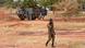 A Burkinabe soldier walks past a French Armoured Personnel Carrier part of a French military convoy heading to Niger, stopped by protesters in Kaya A Burkinabe soldier walks past a French Armoured Personnel Carrier part of a French military convoy heading to Niger, stopped by protesters in Kaya
