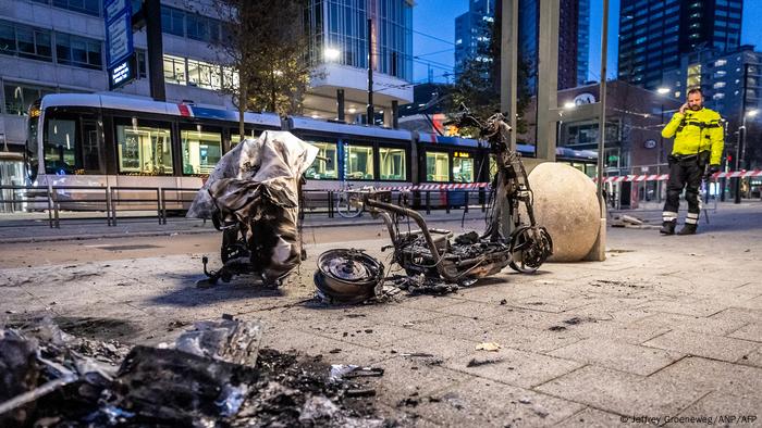  This photograph taken on November 20, 2021 shows a burned electric scooter after a protest against the partial lockdown and against the 2G government policy in Rotterdam.