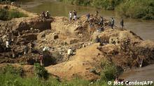 A picture taken 26 May 2006 in Iga Barriere, in the Ituri region of the Democratic Republic of Congo, shows Congolees miners digging a gold field on the banks of the Iga river. Gold washers in this eastern village, who can find around 10 grams (0.35 ounces) of gold on a good day, carry on their daily activities despite the constant threat of insecurity. Three Nepalese soldiers, serving with the UN mission in the Democratic Republic of Congo, were wounded at the weekend and six others remain missing after losing contact with their base, the UN team said 29 May 2006. AFP PHOTO / JOSE CENDON (Photo by JOSE CENDON / AFP)