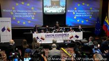 Isabel Santos, member of the European Parliament and Chief Observer of the 2021 EU Election Observation Mission to Venezuela, center, explains her mission's preliminary report on the previous weekend's regional elections in Caracas, Venezuela, Tuesday, Nov. 23, 2021. (AP Photo/Ariana Cubillos)