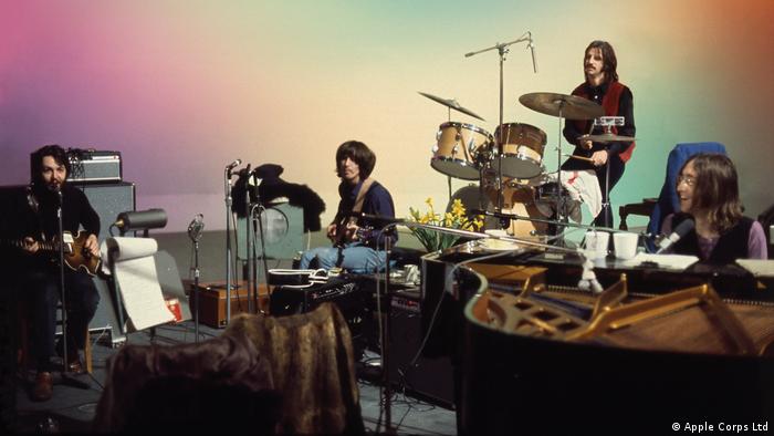 Beatles ,Get Back, four men playing various instruments