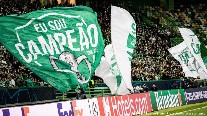Sporting CP fans wave flags at the club's Champions League game against Borussia Dortmund