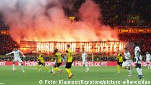 Young Boys' fans burn fireworks during the UEFA Champions League group F soccer match between BSC Young Boys and Atalanta Bergamo, Tuesday, November 23, 2021 at the Wankdorf stadium in Bern, Switzerland. (KEYSTONE/Peter Klaunzer)