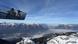 People standing of an Alpine viewing platform looking out at the snow covered peaks, including the Zugspitze, Germany People standing of an Alpine viewing platform looking out at the snow covered peaks, including the Zugspitze, Germany