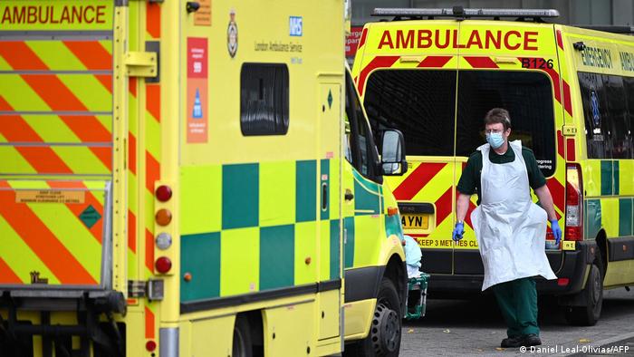 A paramedic walks past ambulances outside the Royal London Hospital in east London