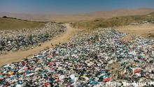 26.09.2021
View of used clothes discarded in the Atacama desert, in Alto Hospicio, Iquique, Chile, on September 26, 2021. - EcoFibra, Ecocitex and Sembra are circular economy projects that have textile waste as their raw material. The textile industry in Chile will be included in the law of Extended Responsibility of the Producer (REP), forcing clothes and textiles importers take charge of the waste they generate. (Photo by MARTIN BERNETTI / AFP)