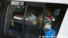 26.11.2021
A passenger in a taxi wears a face mask with colours of the South African flag after the announcement of a British ban on flights from South Africa because of the detection of a new coronavirus disease (COVID-19) variant, in Soweto, South Africa, November 26, 2021. REUTERS/Siphiwe Sibeko