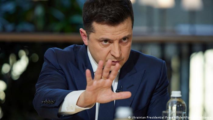 Ukrainian President Volodymyr Zelenskyy gestures while speaking to the media during a news conference in Kyiv, Ukraine, Friday, Nov. 26, 2021.