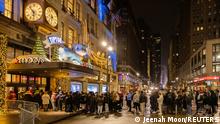 People wait in line at Macy's before Black Friday sales in the Manhattan borough of New York City, New York, U.S., November 26, 2021. REUTERS/Jeenah Moon