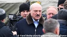 6704682 26.11.2021 Belarusian President Alexander Lukashenko visits a refugee camp at the Bruzgi logistics centre providing accommodation to migrants near the Bruzgi-Kuznica Bialostocka border crossing at the Belarusian-Polish border in Grodno region, Belarus. Migrants from the Middle East and North Africa trapped in Belarus have converged on the border with Poland, where razor wire fences and Polish troops have repeatedly blocked their entry. Pavel Bednyakov / Sputnik